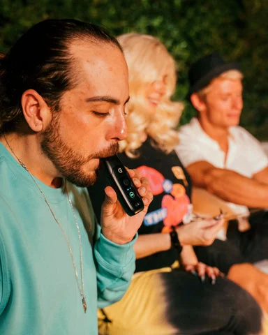 Guy hitting the Dash+ Vaporizer